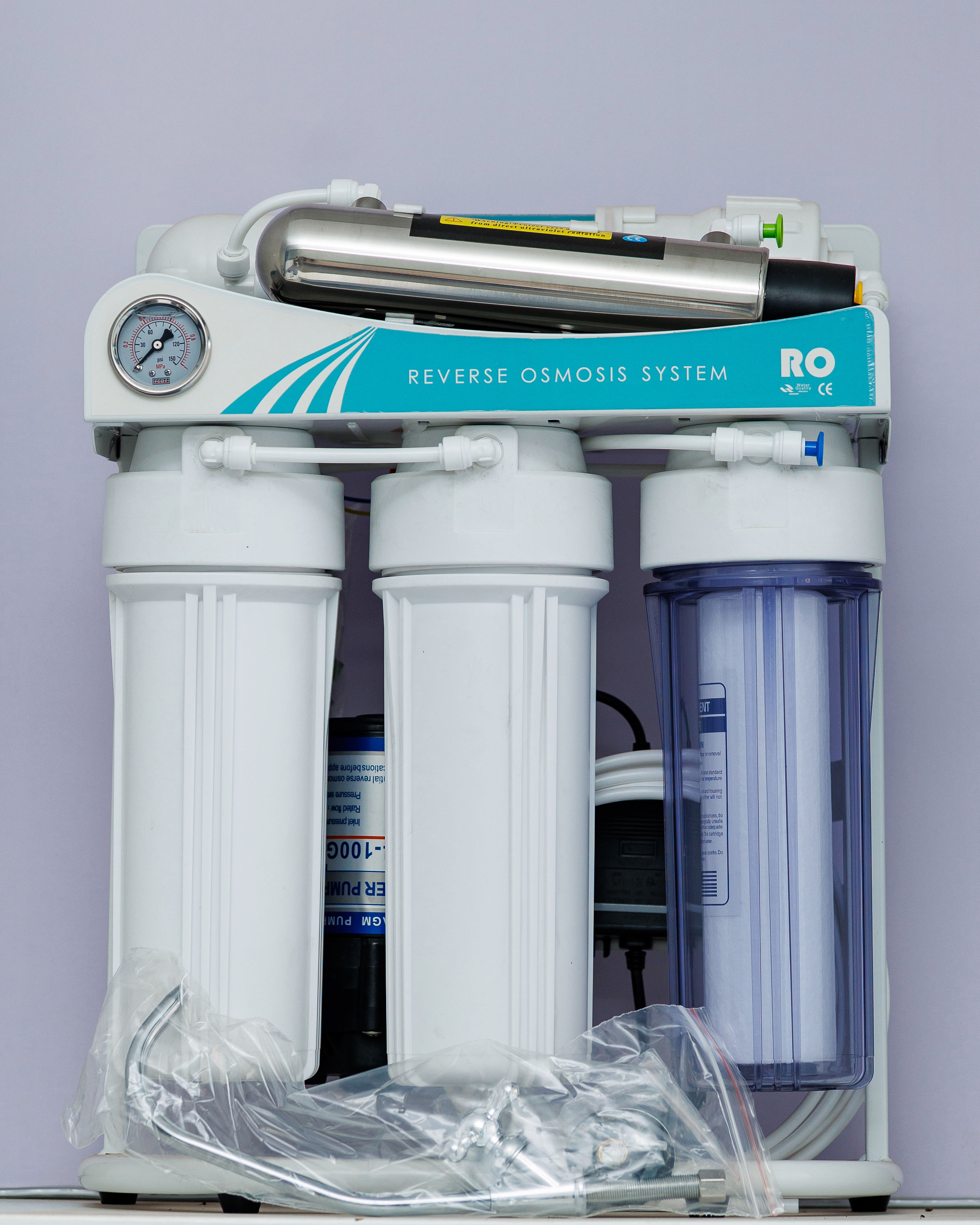AquaTech filtration system installed under a kitchen counter